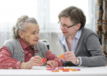 Senior woman with her elder care nurse