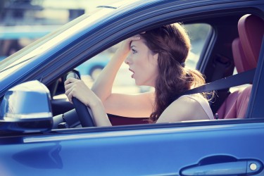 displeased stressed female car driver